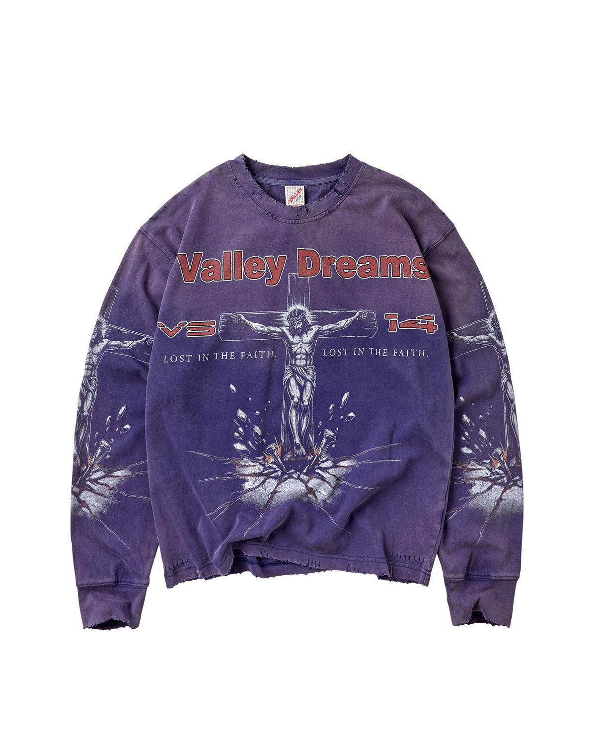 A purple mineral-wash crewneck sweatshirt featuring a graphic of Jesus on the cross with the text 'Valley Dreams' in red across the chest, displayed flat against a white background.